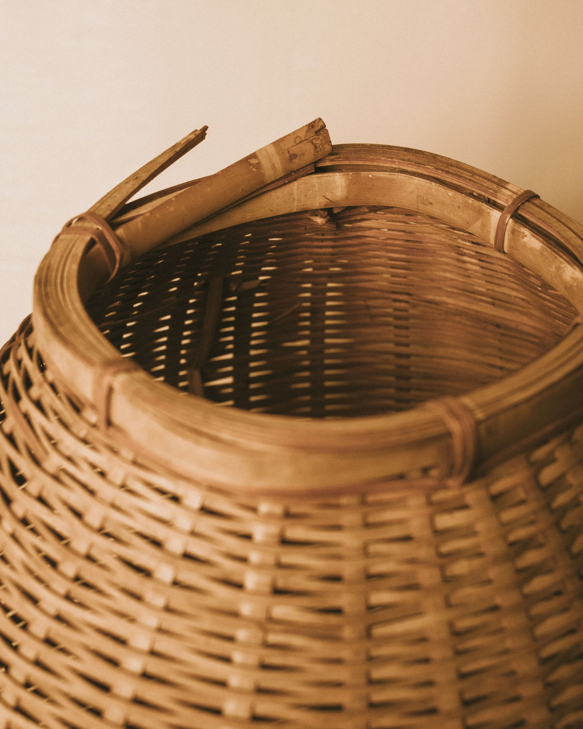 Top-down view of square opening on woven bamboo basket