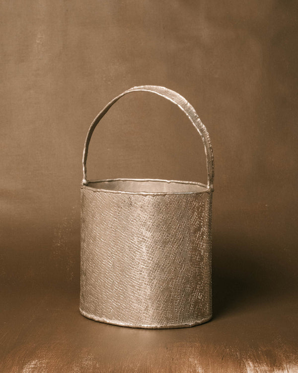 Back view of Basket 2, hand-worked aluminum texture