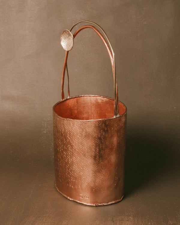 Tapered copper form of Basket 3, angled view