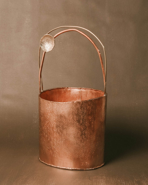 Close-up of curved brass handle on Yeodong Yun's Basket 3