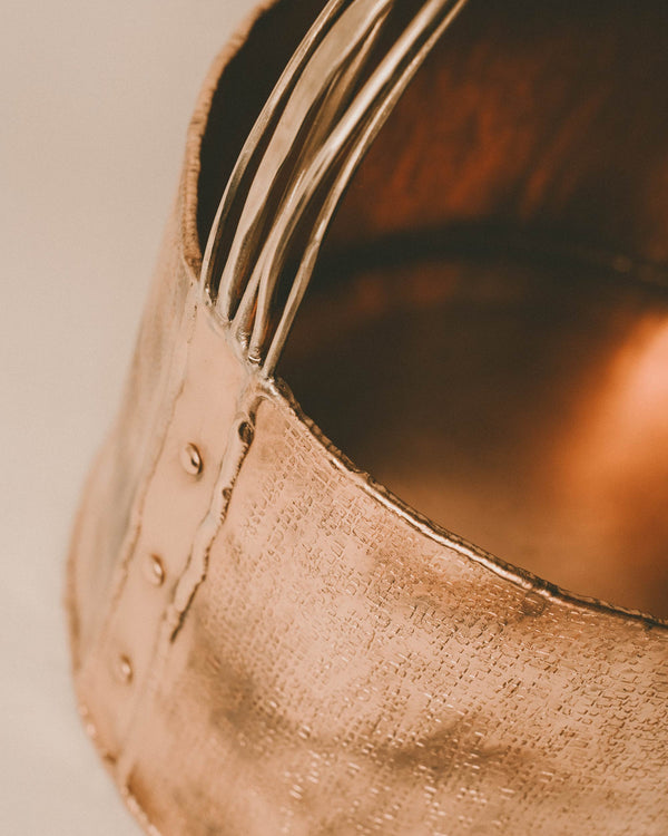 Top-down view of Basket 4 opening, brass handle and copper rim