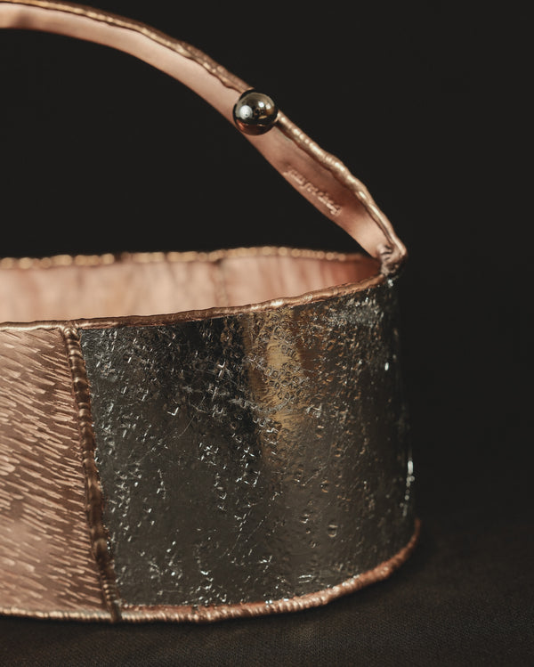 Back view of Container 1, joined copper and brass surfaces