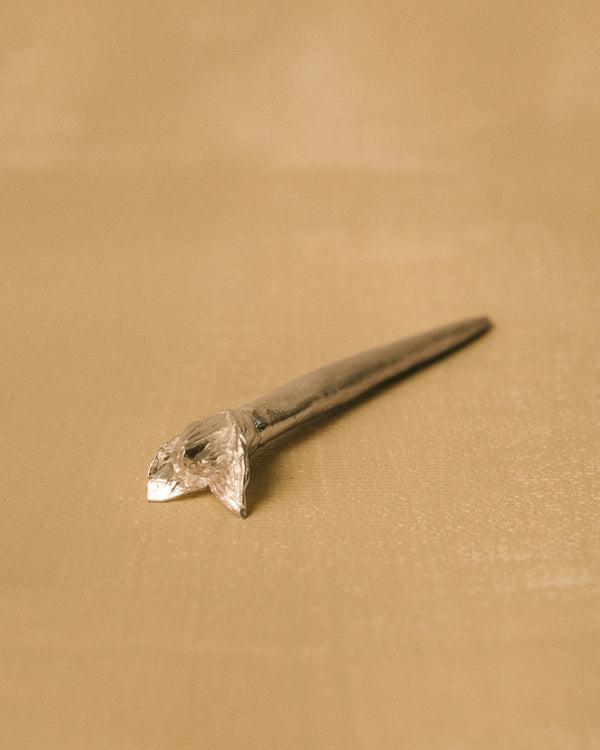 Yeodong Yun Dessert Picks laid at angle, handmade silver picks with sculptural flower tops