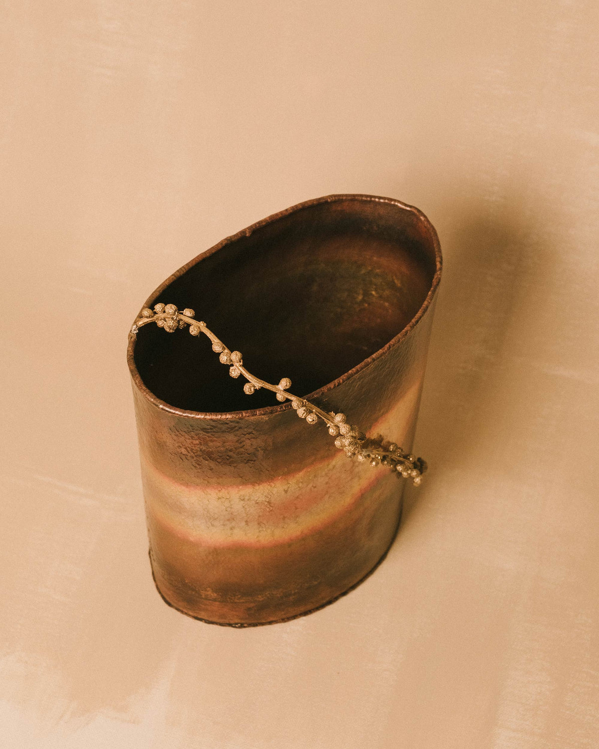 Angled view of Mimosa Bucket opening, brass handle detail