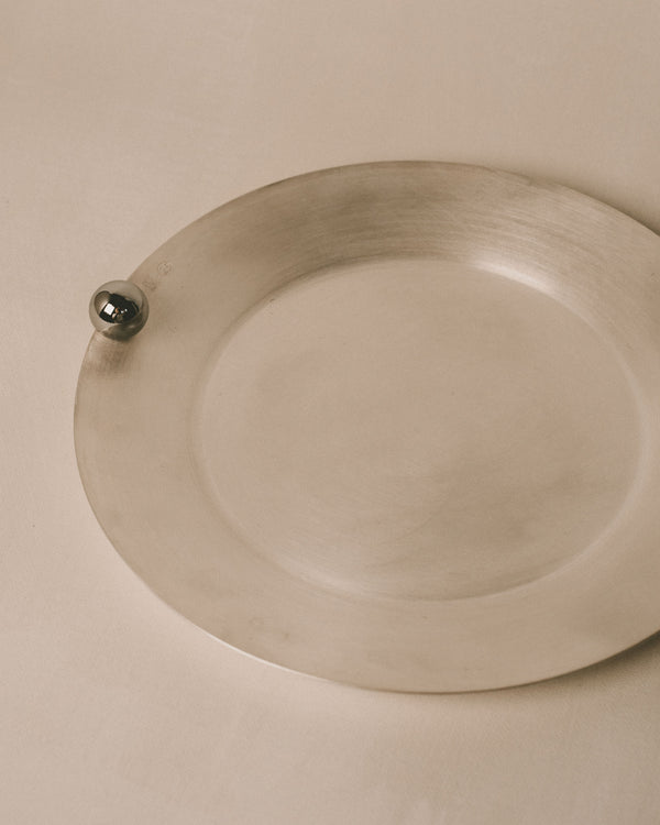 Yeodong Yun Plate 2, angled view of brushed silver-plated copper with restrained luminosity