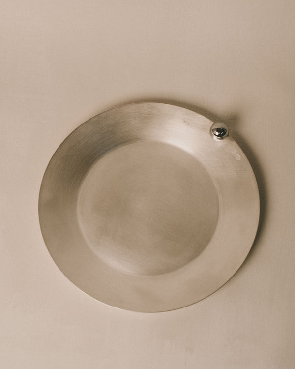 Plate 2 by Yeodong Yun in silver-plated copper, top-down view showing single polished sphere